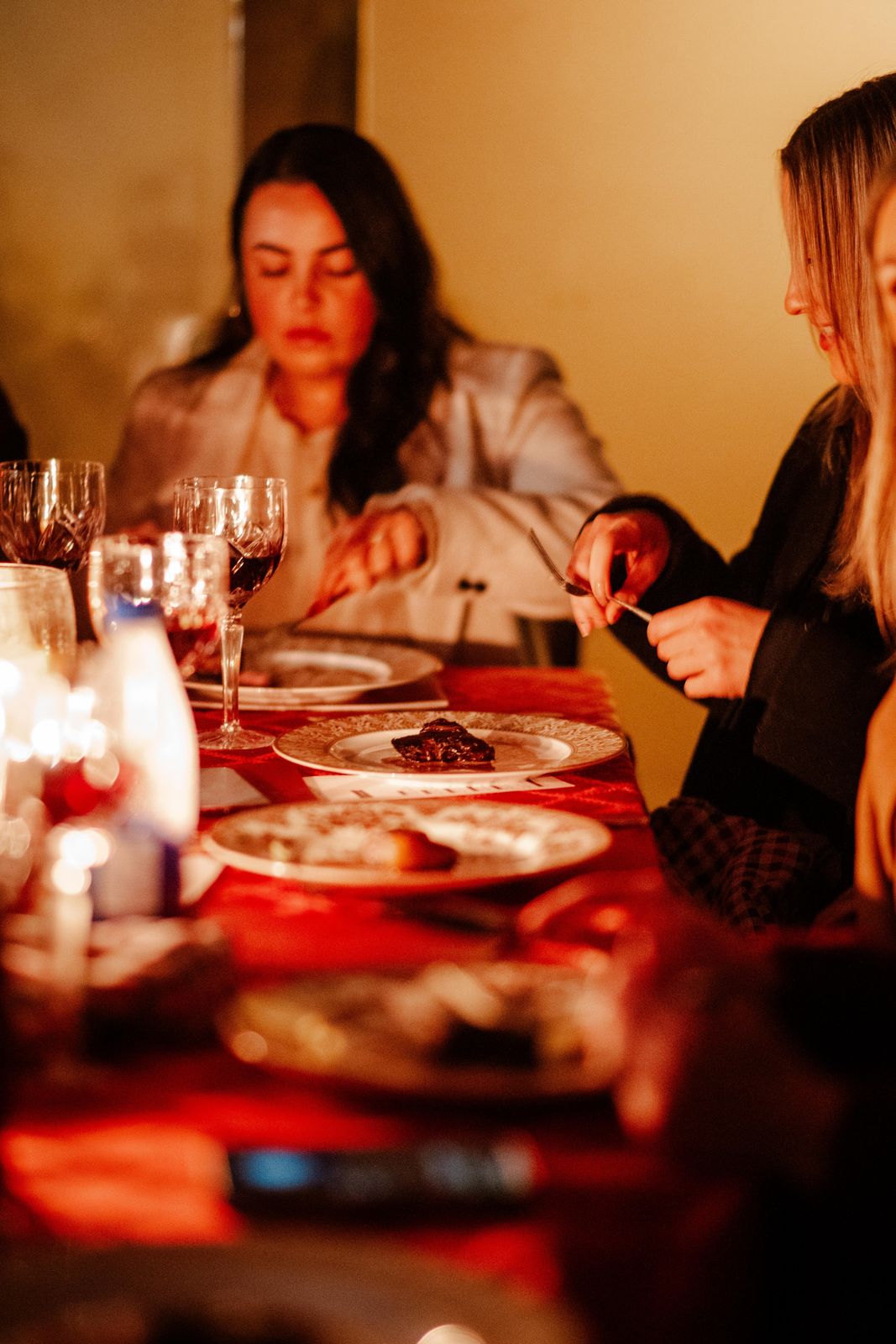 Guests at a candlelit dinner