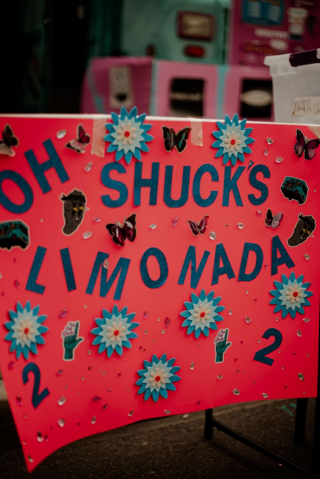 A hand painted Oh Shucks Limonada sign at Sundays Unlocked