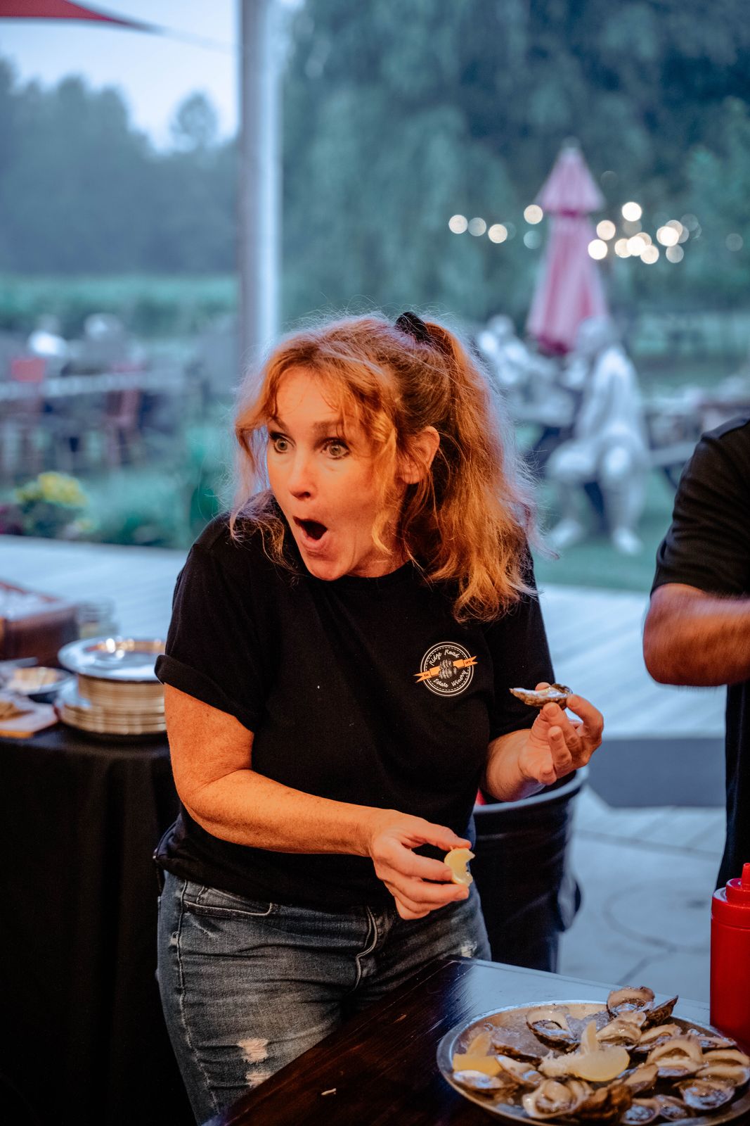 A staff member reacting at the oyster bar