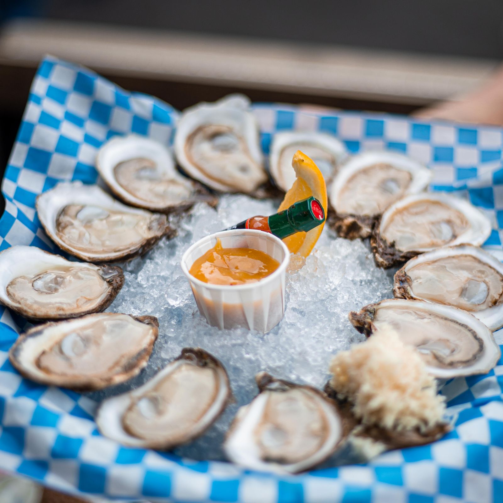 A full oyster platter with lemon and mignonette