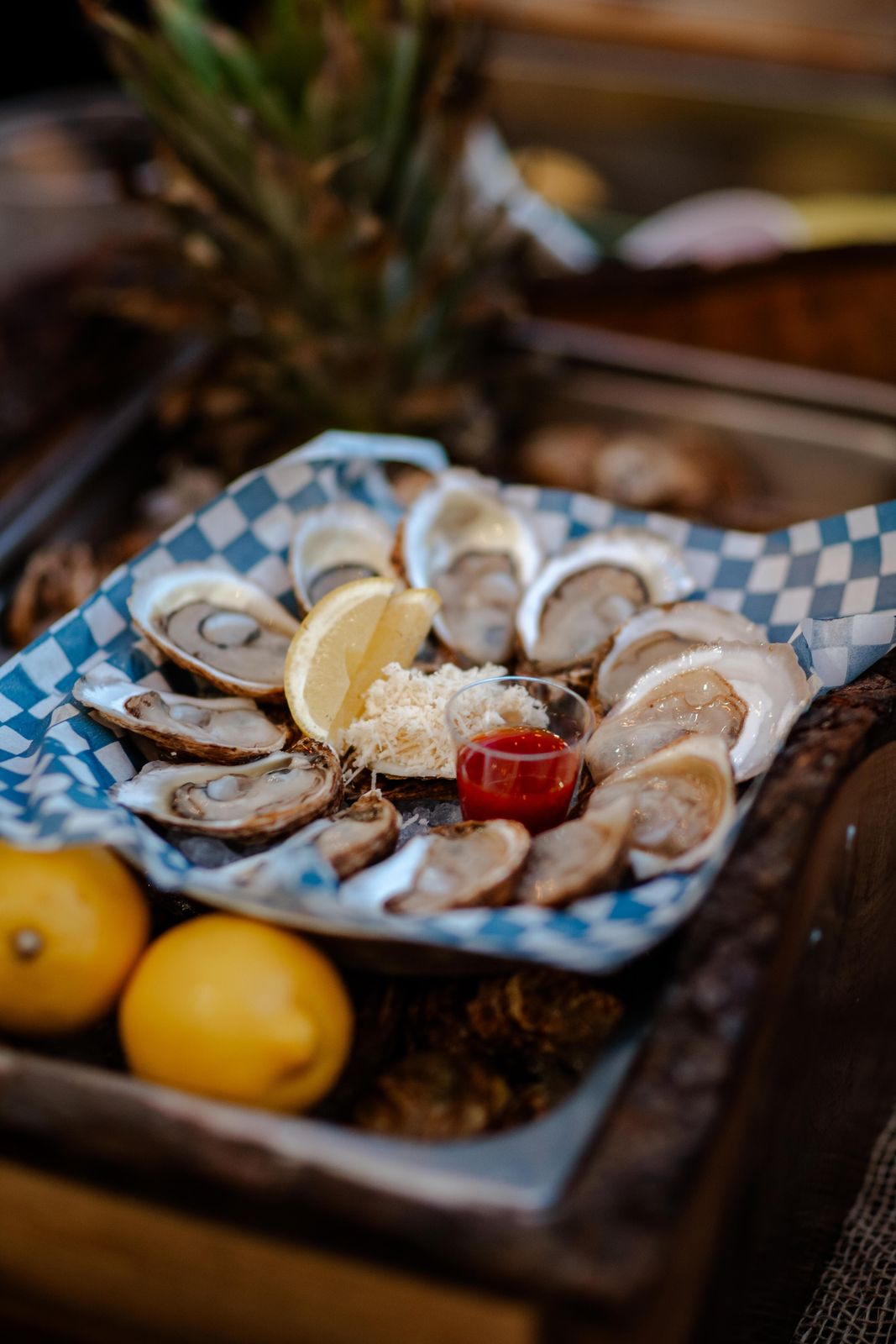 An oyster platter with lemons at a supper club