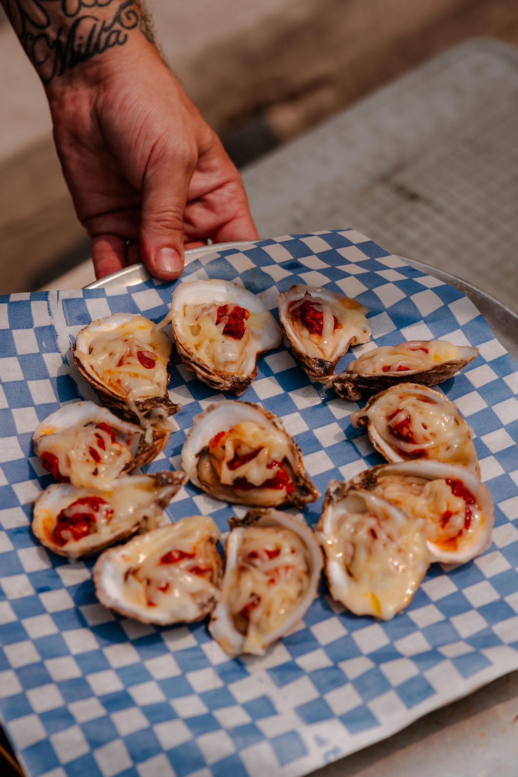 Dressed oysters on a blue check plate at Sundays Unlocked