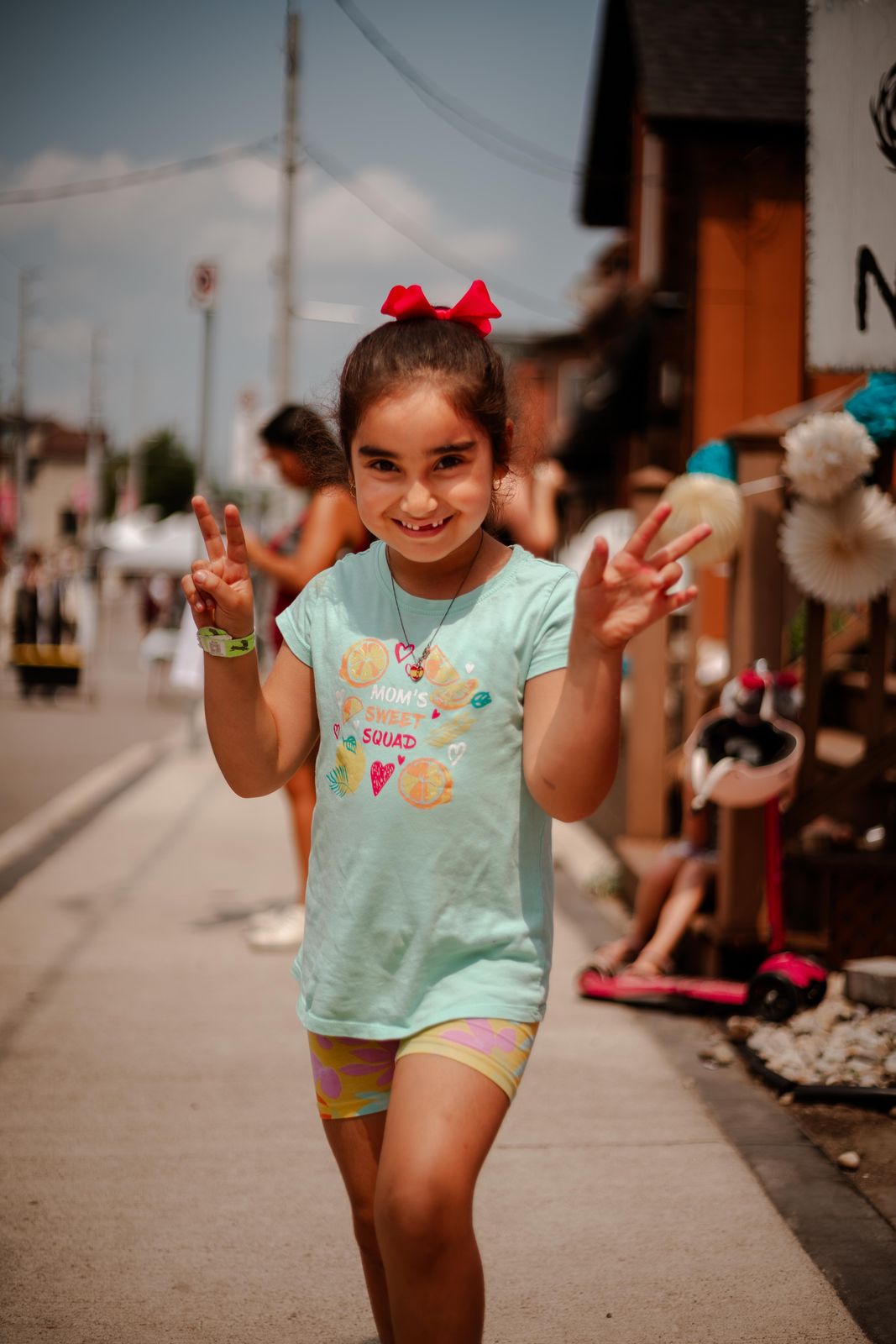 A little girl dancing in the street at Sundays Unlocked