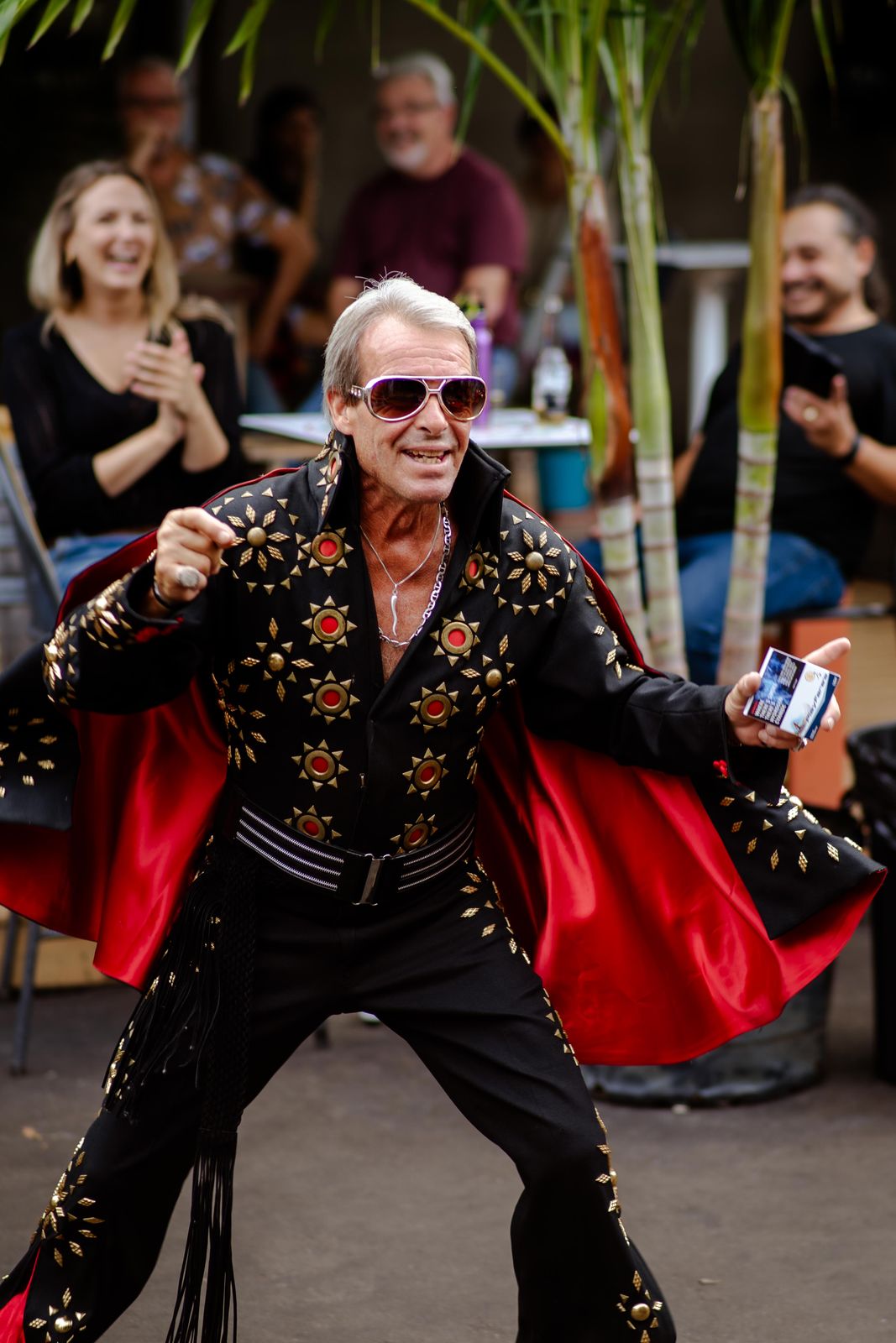 An Elvis performer dancing in the street at Supercrawl