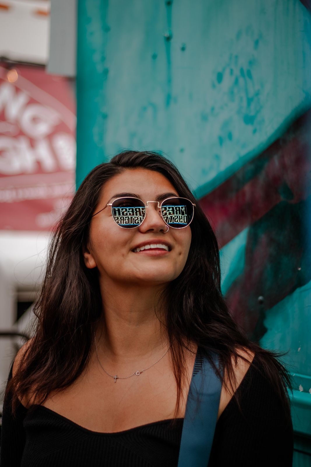 A guest in sunglasses smiling at Supercrawl