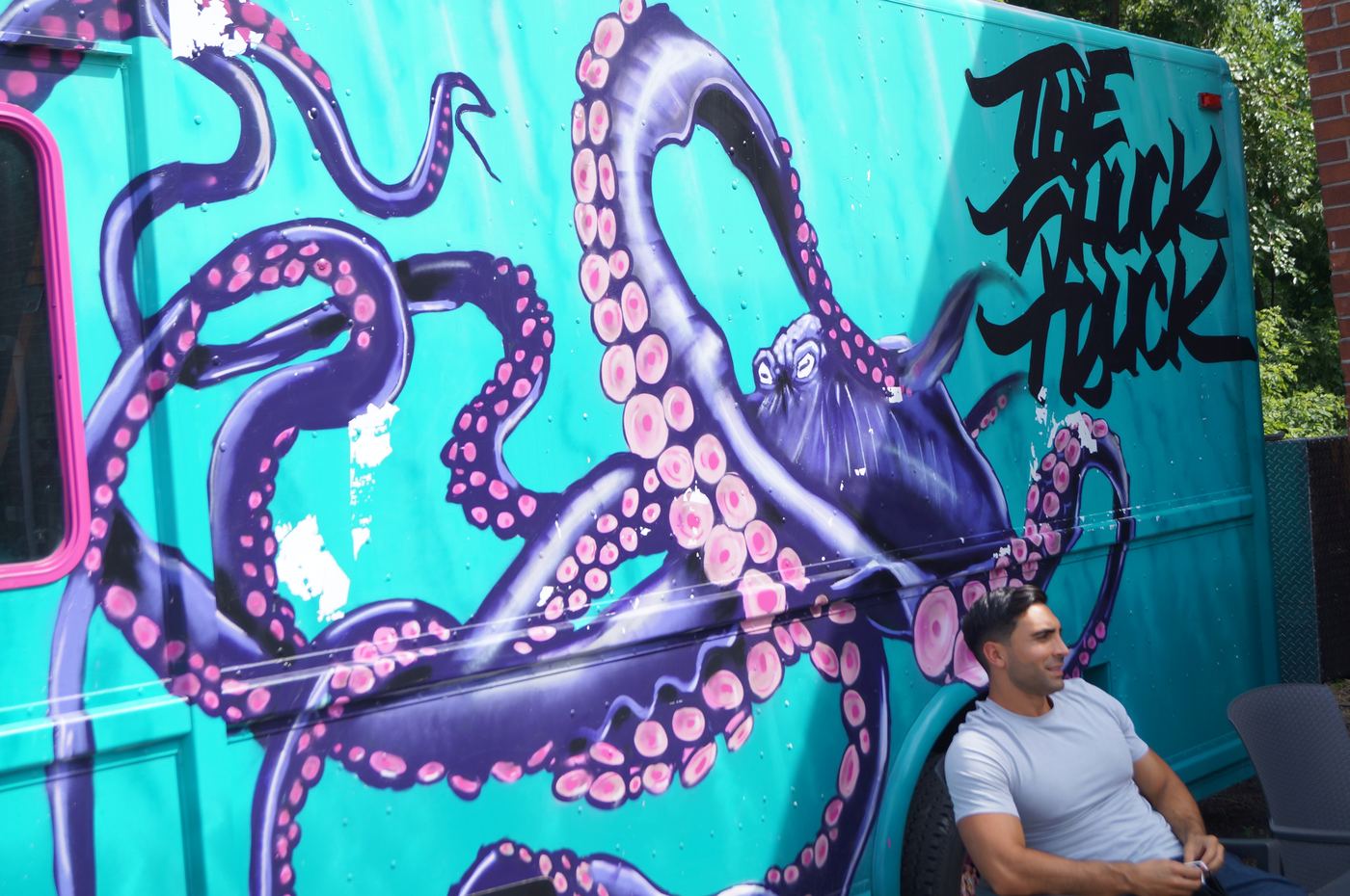 The purple octopus mural painted on the side of the truck