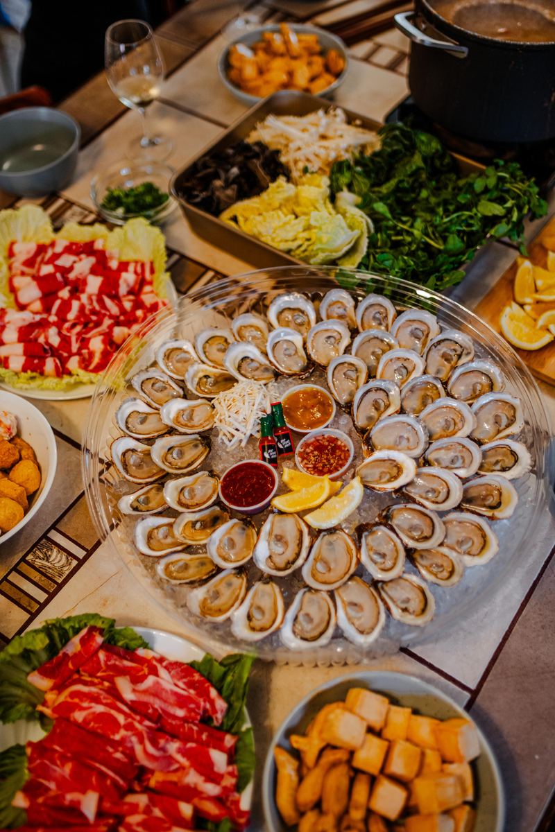 The 50 oyster platter at the centre of a hot pot dinner table
