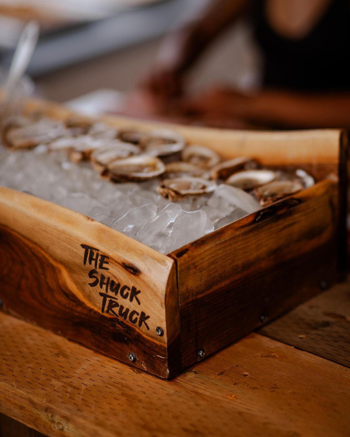 The Shuck Truck branded raw bar box with oysters on ice